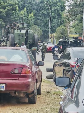 Armoured vehicles deployed at a location.