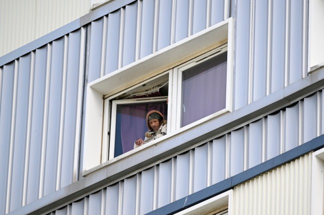 Police surrounding the Edinburgh tower where the stabbings occurred