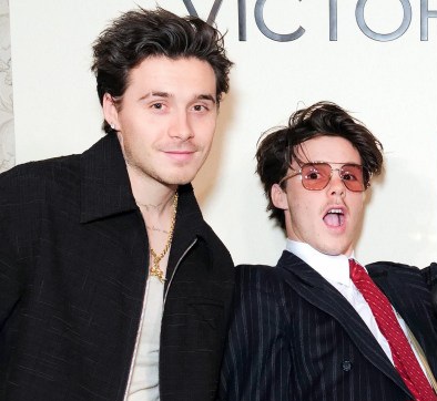 Cruz Beckham seen smiling while discussing birthday wishes for his brother Brooklyn.