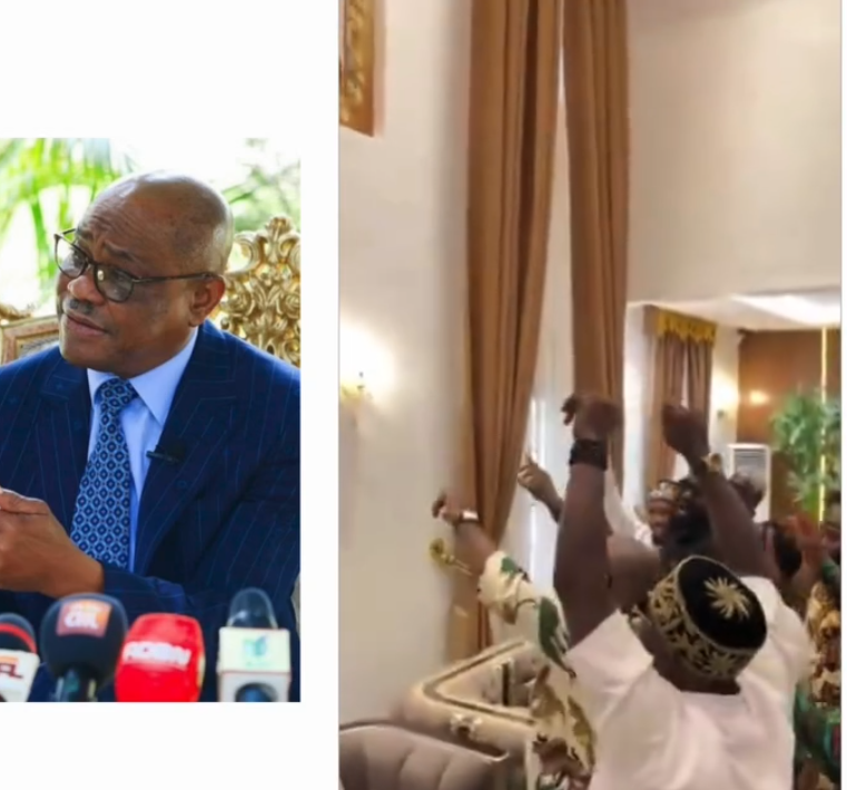 Screenshot of a video showing people gathered around a portrait of Nyesom Wike.