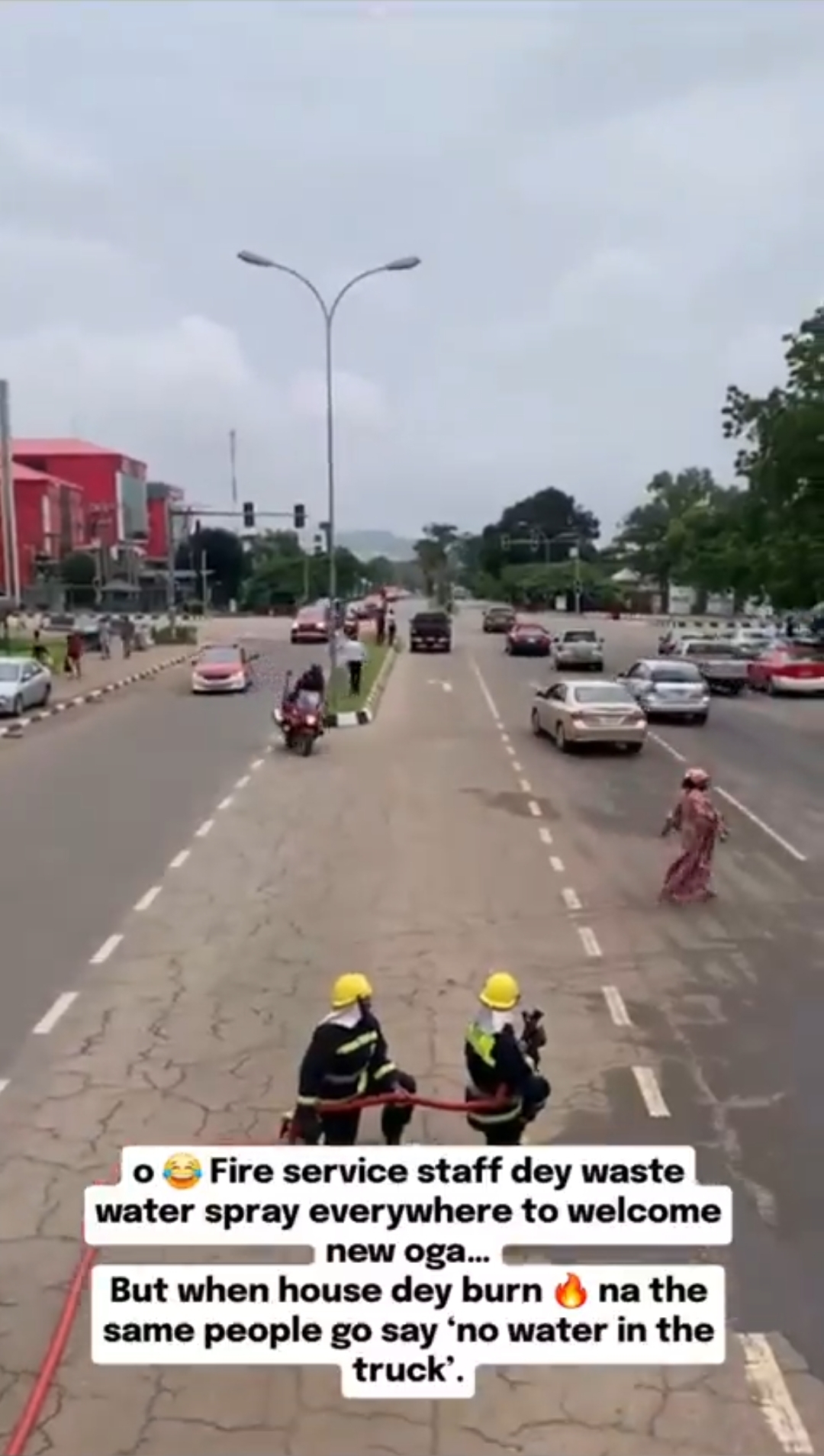Federal Fire Service officers celebrating their new boss with water