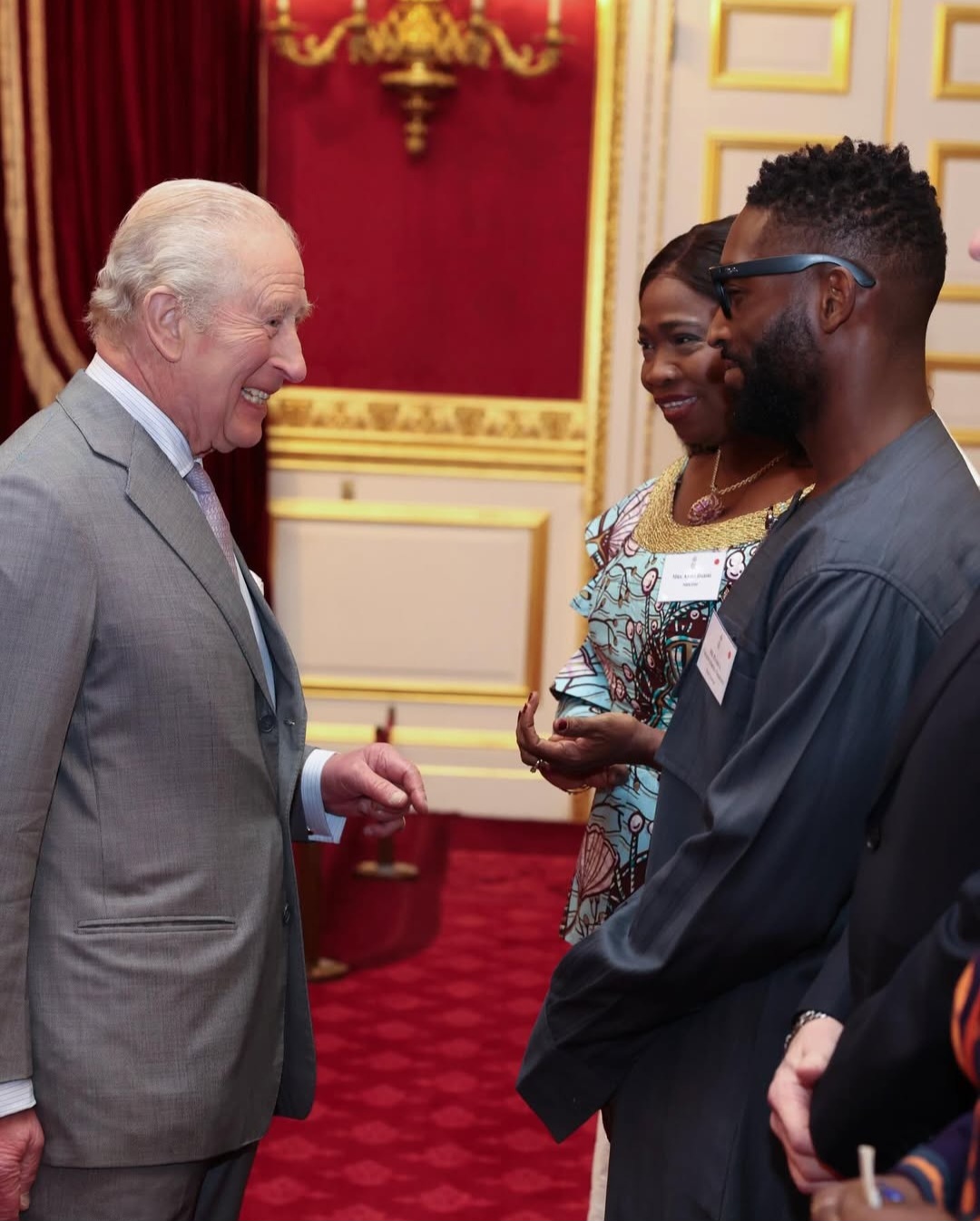 King Charles conversing with guests during the reception for Nigerians in the UK