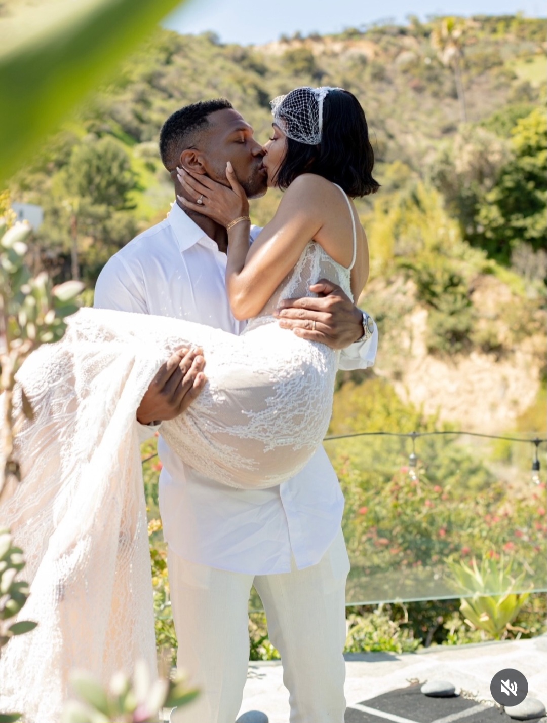 Meagan Good celebrating with Jonathan Majors on their wedding day.