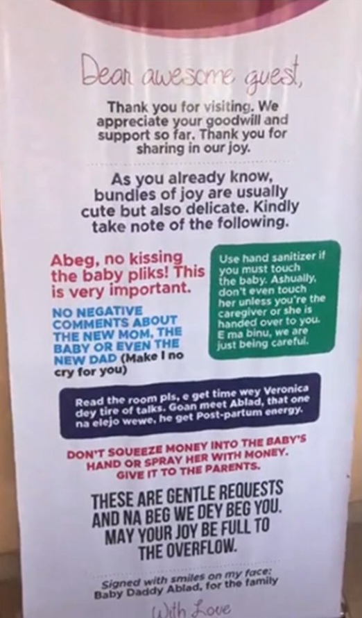 A humorous banner posted by new parents with guidelines for visitors to meet their baby