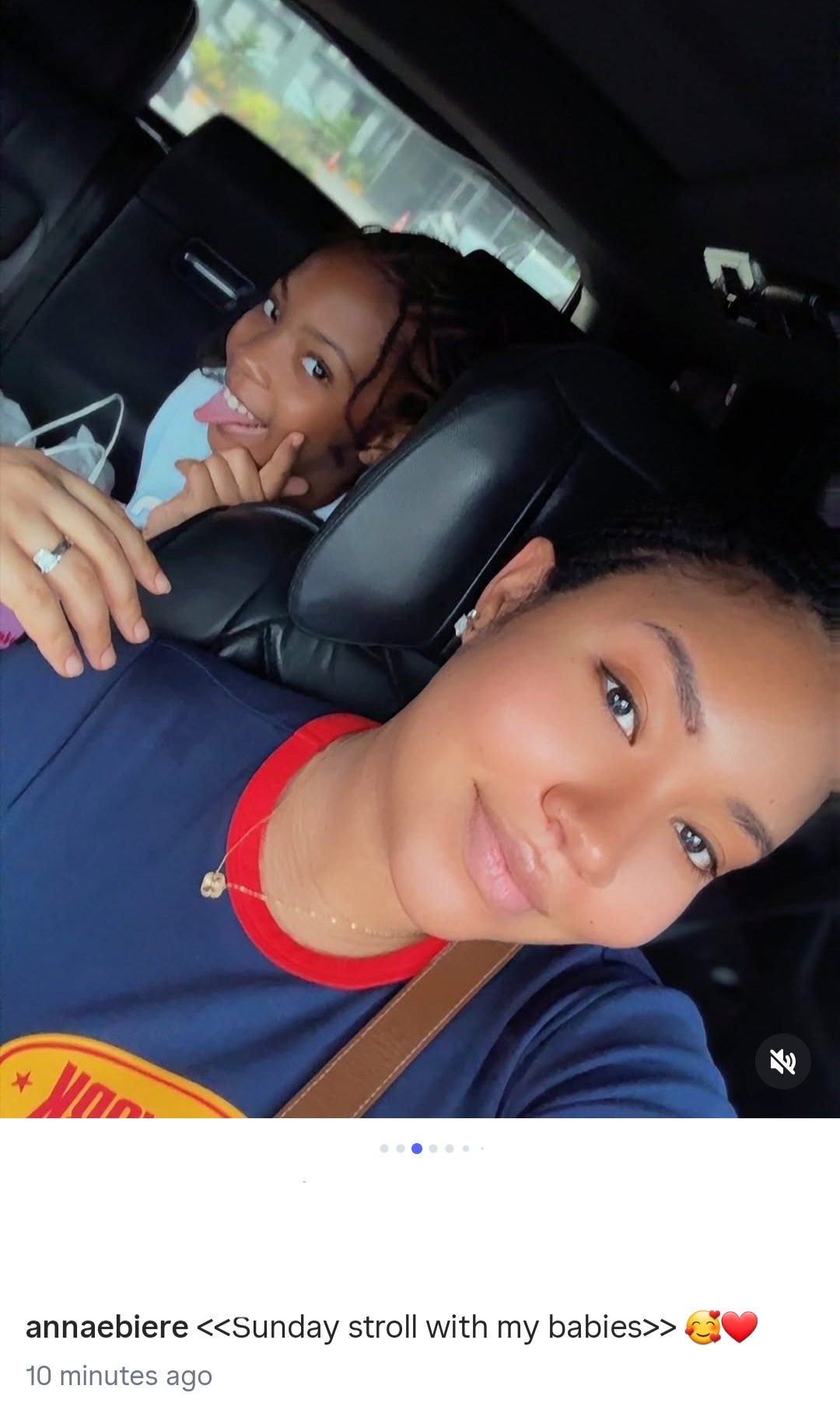 Another photo from Anna Banner's family stroll showing her with her husband and daughter.