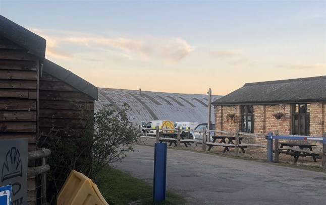 Skydiver preparing for a jump, illustration of a parachute.