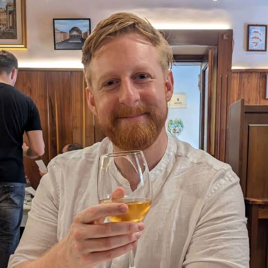 Michael Patrick in character, appearing to be from a film or TV show.