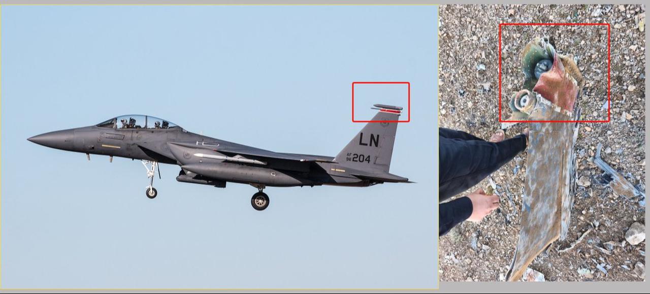 Wreckage of what is described as a downed US fighter jet being loaded onto a truck.