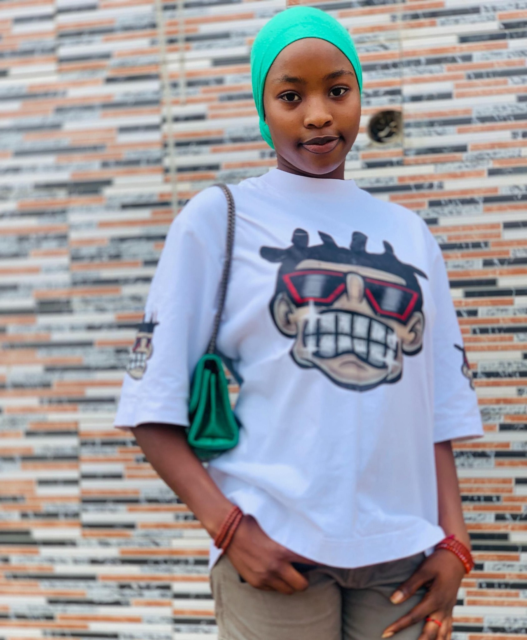 Mourners pay tribute at the site where the body of Suleiman Rahama Onono was found